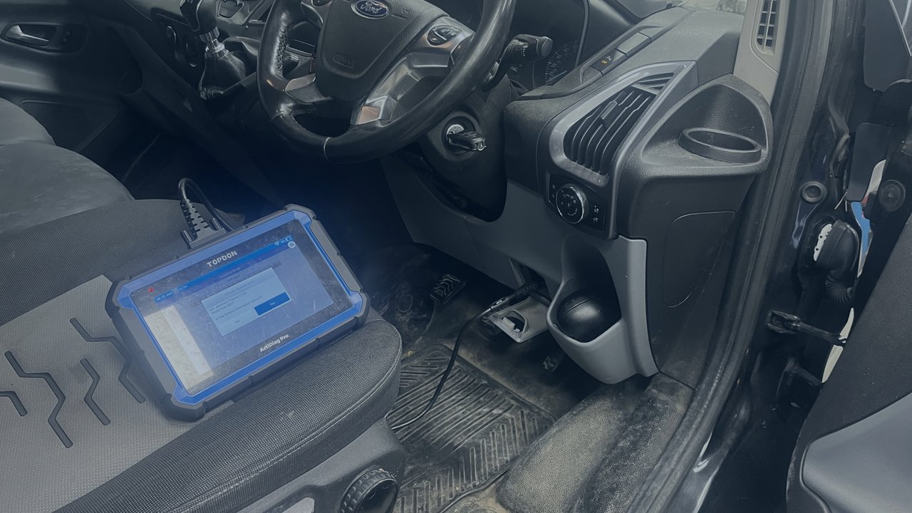 Diagnostic equipment plugged into a vehicle for its MOT emissions and electronic checks at R. Taylor Workshop